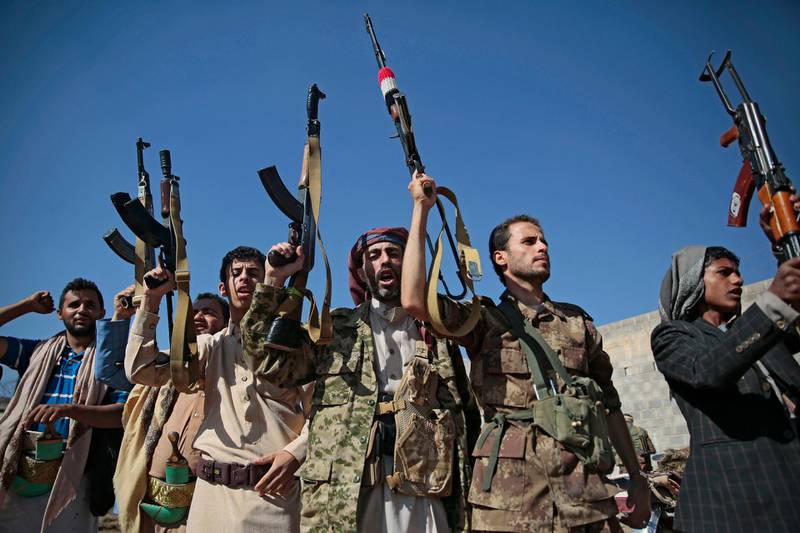 FILE - In this Dec. 13, 2018, file, photo, tribesmen loyal to Houthi rebels hold up their weapons as they attend a gathering to show their support for the ongoing peace talks being held in Sweden, in Sanaa, Yemen. The United Nations has cast doubt on the claims by Yemenâ€™s Shiite rebels to have withdrawn from the port of Hodeida, saying such steps can only be credible if all other parties can verify them.(AP Photo/Hani Mohammed, File)