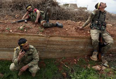 Turkish-backed Free Syrian Army fighters are seen in Khaldieh village in eastern of Afrin, Syria on March 10, 2018. Khalil Ashawi / Reuters