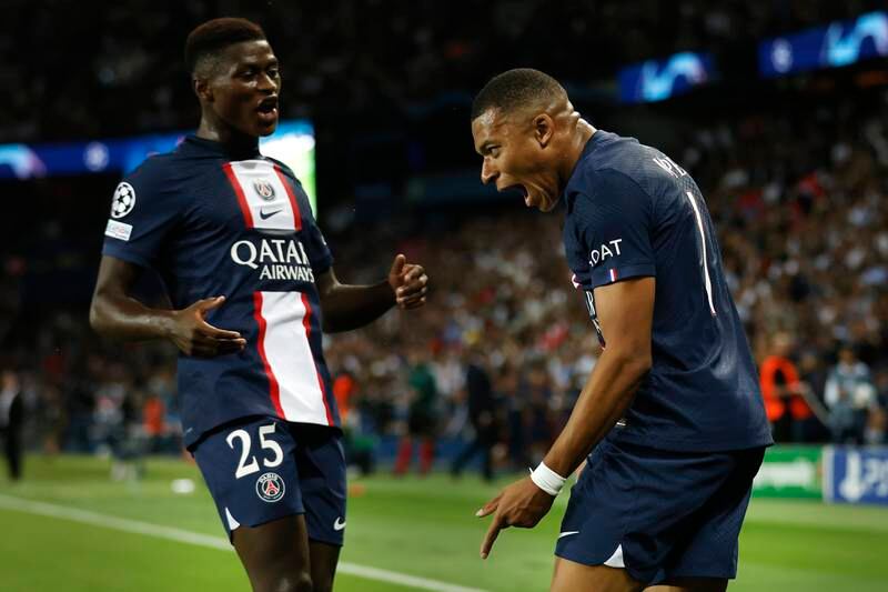 Kylian Mbappe with teammate Nuno Mendes. EPA