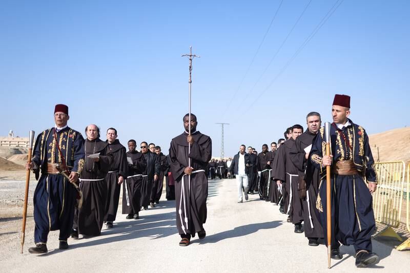 Clergymen join the procession at the holy site, en route to the river. EPA