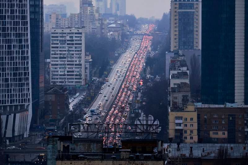 Cars stream out of Kyiv as residents flee the Russian invasion of Ukraine on February 24. Getty Images