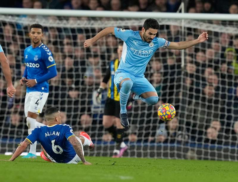 Ilkay Guendogan, right, of Manchester City in action against Allan of Everton. EPA
