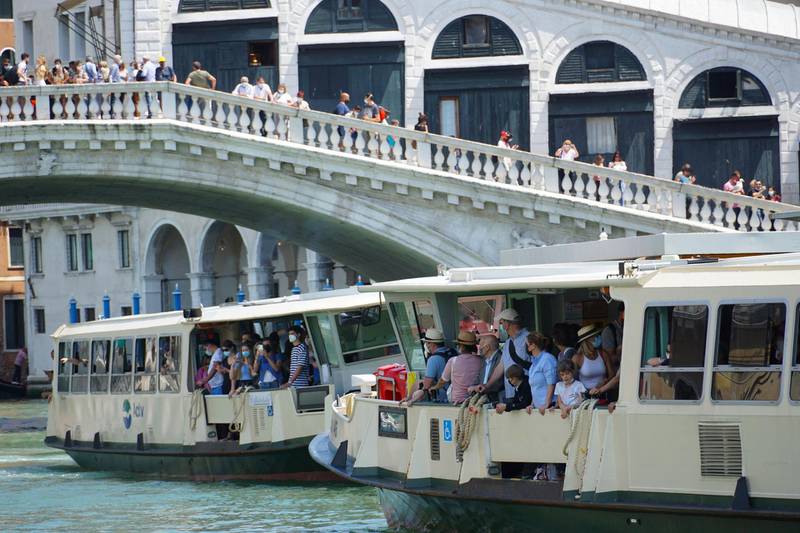 Tourists on a public waterbus on the Canal Grande, in Venice, Italy. The Italian Health Ministry announced that the Italian regions of Abruzzo, Liguria, Umbria and Veneto will fall in the low-risk white zone starting June 7th.  EPA