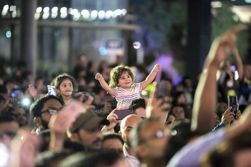 Abu Dhabi, United Arab Emirates - A child enjoying the music of DJ Jazzy Jeff at the Block Party at The Galleria, Al Maryah Island.  Leslie Pableo for The National