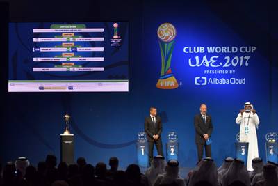 From left to right, retired Colombian footballer Ivan Cordoba, Head of Fifa tournaments Jaime Yarza watch as UAE footballer Abdulrahim Jumaa shows a group position in the official draw of the Fifa Club World Cup in Abu Dhabi. All photos Giuseppe Cacace / AFP Photo