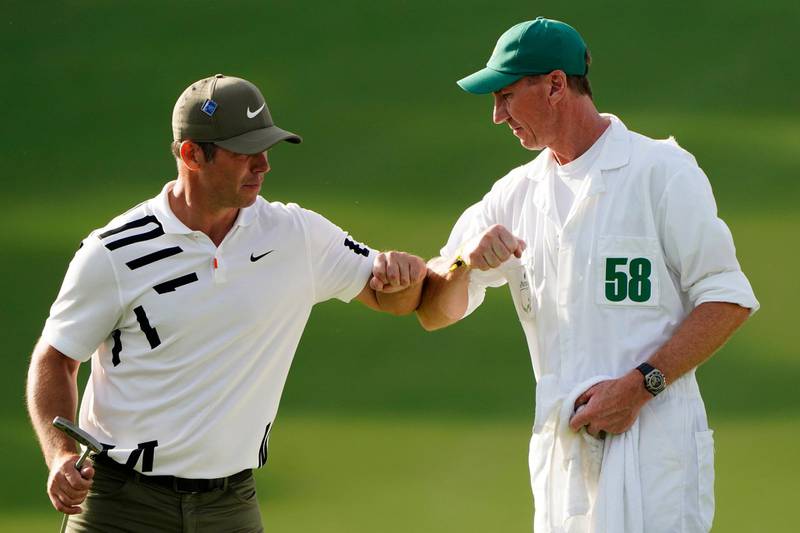 Paul Casey with caddie John MacLaren after the Englishman's bogey-free first round 68 at the Masters on Thursday. AP