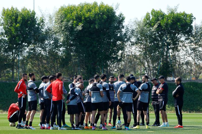 Jordan manager Hussein Ammouta addresses his players before training on Friday ahead of the Asian Cup final. AFP