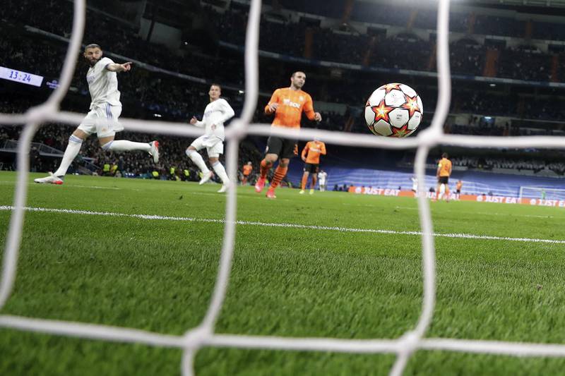 Real Madrid's Karim Benzema, left, scores the opening goal. AP Photo