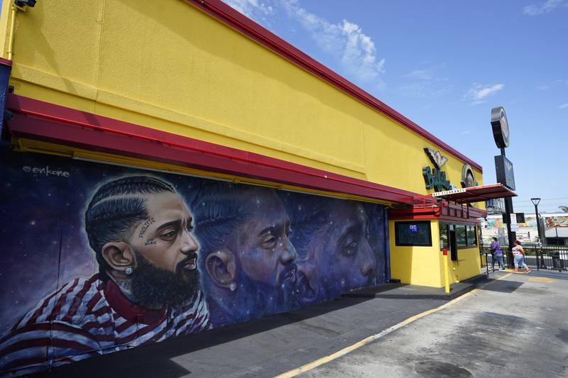 Another Hussle mural near his closed The Marathon Clothing shop in Los Angeles, California. AP