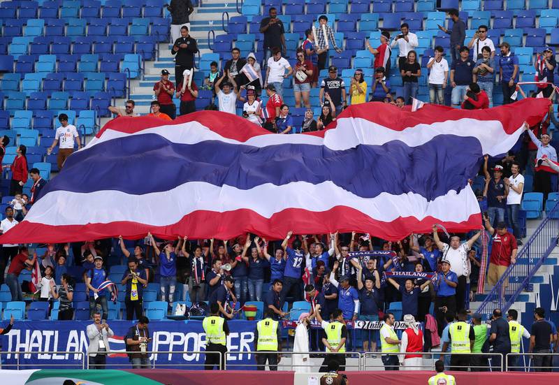 Dubai, United Arab Emirates - January 10, 2019: Thailand fans after their win at the game between Bahrain and Thailand in the Asian Cup 2019. Thursday, January 10th, 2019 at Al Maktoum Stadium, Abu Dhabi. Chris Whiteoak/The National