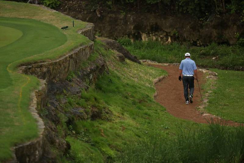 JB Holmes walks the third hole on March 24, 2017, during Round 3 of the World Golf Championships-Dell Technologies match play at the Austin Country Club in Austin, Texas. Christian Petersen / Getty Images / AFP