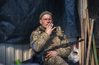 A Ukrainian serviceman rests at his position in Kharkiv, Ukraine. AP