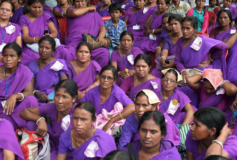 Indian members of the Accredited Social Health Activist (ASHA) attend a meeting to demand recognition as government health workers in Kolkata on September 8, 2015. One of the key components of the National Rural Health Mission is to provide every village in the country with a trained female community health activist known as an ASHA. AFP PHOTO/Dibyangshu SARKAR (Photo by DIBYANGSHU SARKAR / AFP)