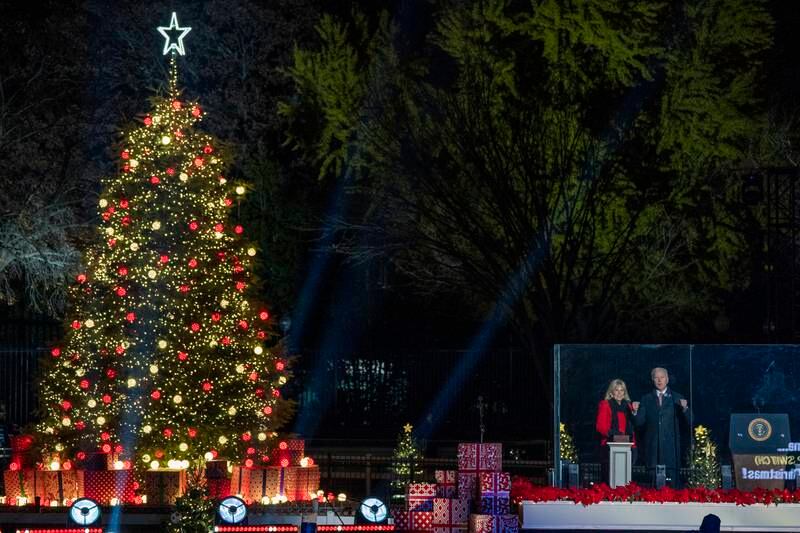 Mr Biden and his wife attend the 2021 National Christmas Tree lighting ceremony on the Ellipse in Washington on December 2. EPA