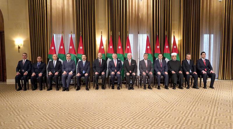 A handout picture released by the Jordanian Royal Palace on November 7, 2019 shows Jordanian King Abdullah II (C) and his Prime Minister Omar Razzaz (6th-L) posing for a group photo with new sworn-in ministers following a cabinet reshuffle in the capital Amman.  - RESTRICTED TO EDITORIAL USE - MANDATORY CREDIT "AFP PHOTO / JORDANIAN ROYAL PALACE / YOUSEF ALLAN" - NO MARKETING NO ADVERTISING CAMPAIGNS - DISTRIBUTED AS A SERVICE TO CLIENTS
 / AFP / Jordanian Royal Palace / - / RESTRICTED TO EDITORIAL USE - MANDATORY CREDIT "AFP PHOTO / JORDANIAN ROYAL PALACE / YOUSEF ALLAN" - NO MARKETING NO ADVERTISING CAMPAIGNS - DISTRIBUTED AS A SERVICE TO CLIENTS

