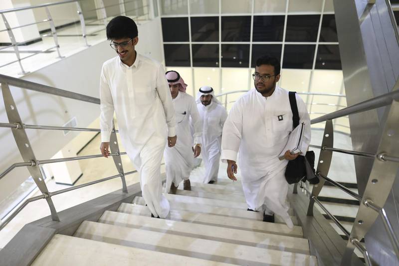 A group of business students climb the stairs inside the Sulaiman al-Rajhi college in Qassim, Saudi Arabia, on Wednesday, Nov. 30, 2016. Young Saudi entrepreneurs at a Riyadh conference last month mingled comfortably across the gender divide, while a few days before the event an all-male class of business students in Qassim were debating how much change they’d feel comfortable with. Photographer: Simon Dawson/Bloomberg