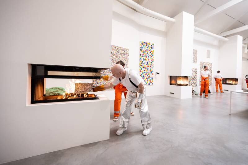 Damien Hirst takes part in the burning of his artworks at Newport Street Gallery in London, England. Getty Images