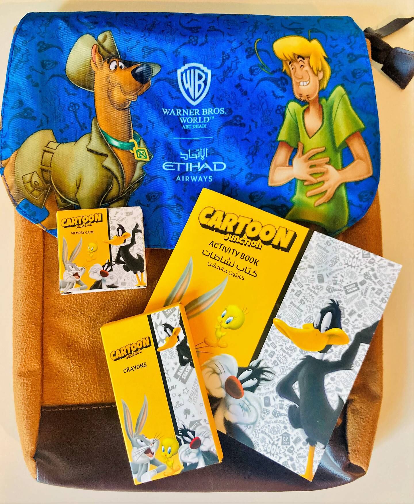 Little VIP travellers' flying Etihad receive Looney Tunes and Scooby-Doo themed activity packs.
