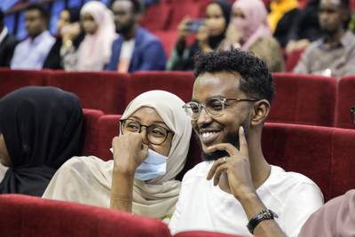 Viewers wait for the first screening of Somali films at The Somali National Theatre in Mogadishu, on September 22, 2021, which has been opened for the first time to public after its inauguration in 2020.  (Photo by Abdirahman YUSUF  /  AFP)