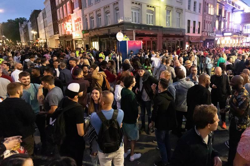 Reveller socialise in the street during the evening in Soho, London, Britain. Pubs, restaurants, places of worship, hairdressers and other businesses have reopened their doors across the UK on 'Super Saturday' after more than three months of lockdown.  EPA