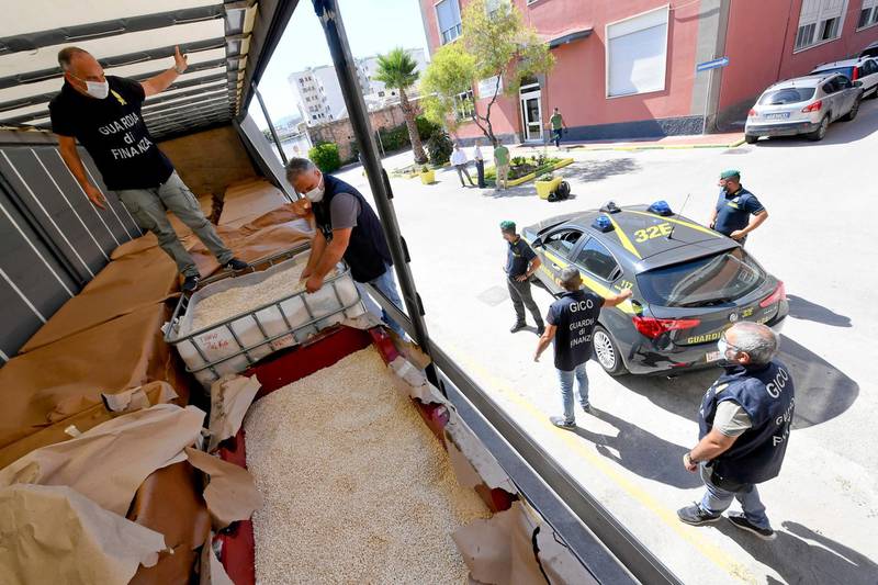 MMembers of the Naples branch of the Italian Guardia di Finanza (GdF) law enforcement agency inspect a world record seizure of a 14-tonne haul of amphetamines.  EPA