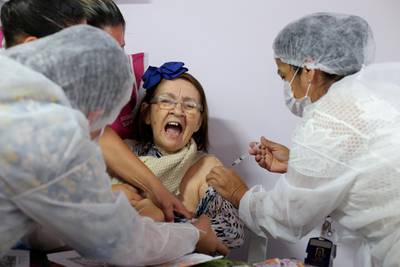 A health worker administers a Covid-19 vaccine to a resident at Solar das Acacias nursing home, in Guarulhos, near Sao Paulo, Brazil. Reuters