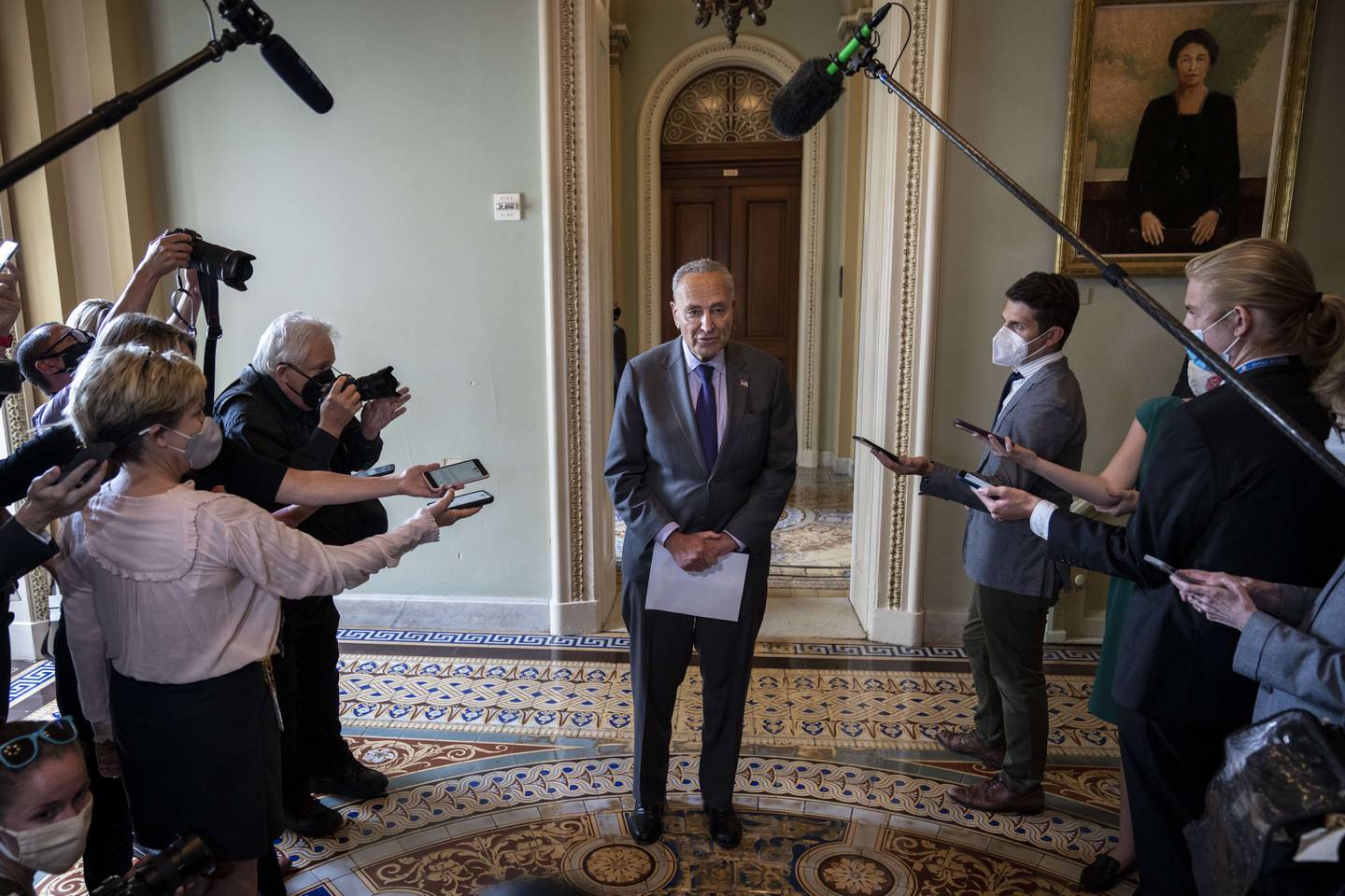 Senate Majority Leader Chuck Schumer speaks briefly to reporters after a meeting with Senate Democrats at the US Capitol on July 28, 2021 in Washington. AFP