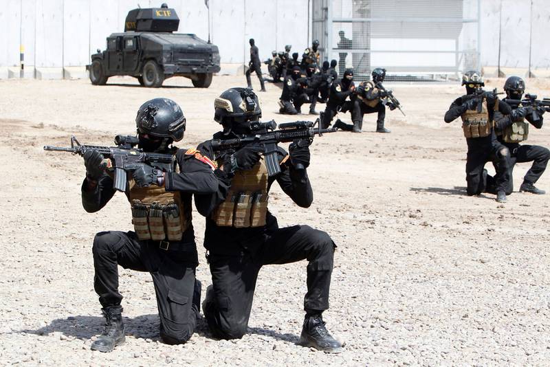 Members of the 'Golden Division', a special forces unit that is part of Iraq's counter-terrorism forces, take part in a training exercise under the guidance of international military instructors in Baghdad in March 2016, as they prepare to retake Mosul. AFP