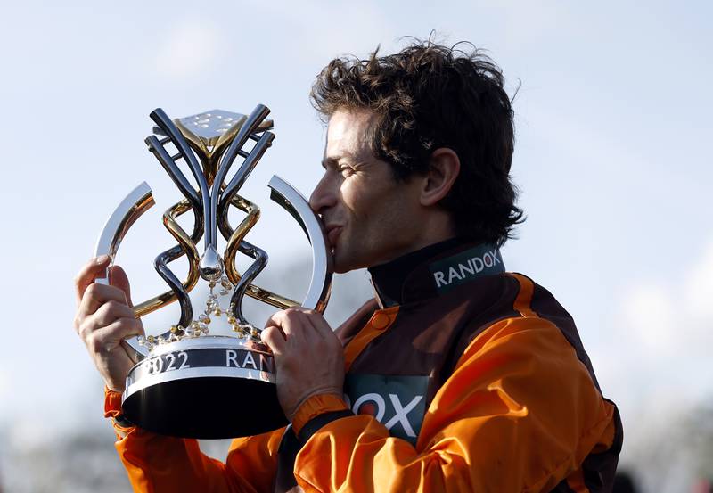 Jockey Sam Waley-Cohen with the trophy after winning the Grand National on Noble Yeats. PA