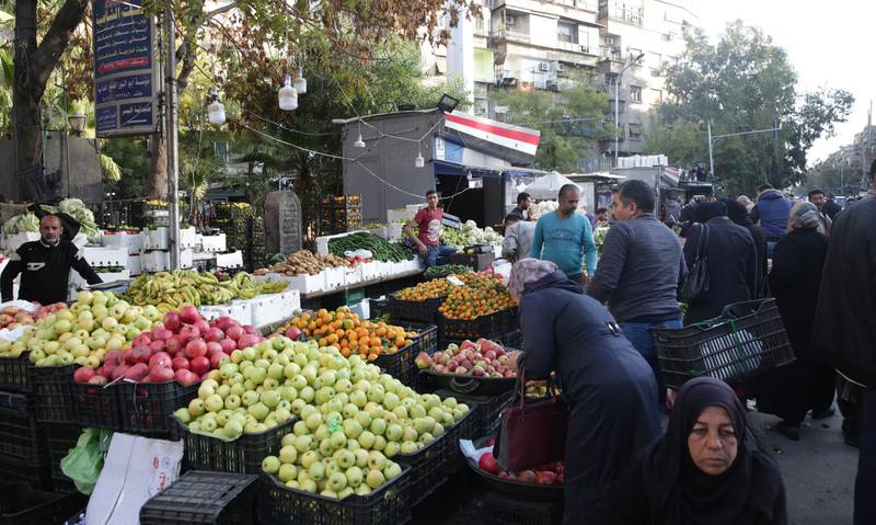 epa08035568 Syrians are shopping for vegetables and fruits in one of the markets of Damascus, Syria, 30 November 2019. Markets have relatively flourished following the recent salary increase for civil servants granted by President Bashar Assad granted on Nov. 21. The increase came to make a somehow balance in the markets following the unprecedented hike in the Damascus exchange rate of the dollar against the pound that stood at 820 per dollar, prompting merchants to raise the prices of almost all commodities by around 30 percent. The Syrian pound has fallen to its lowest level against the US dollar in roughly nine years, and hit the highest level on Saturday (820) on the black market, the highest figure ever since the start of the crisis in the country in 2011  EPA/YOUSSEF BADAWI