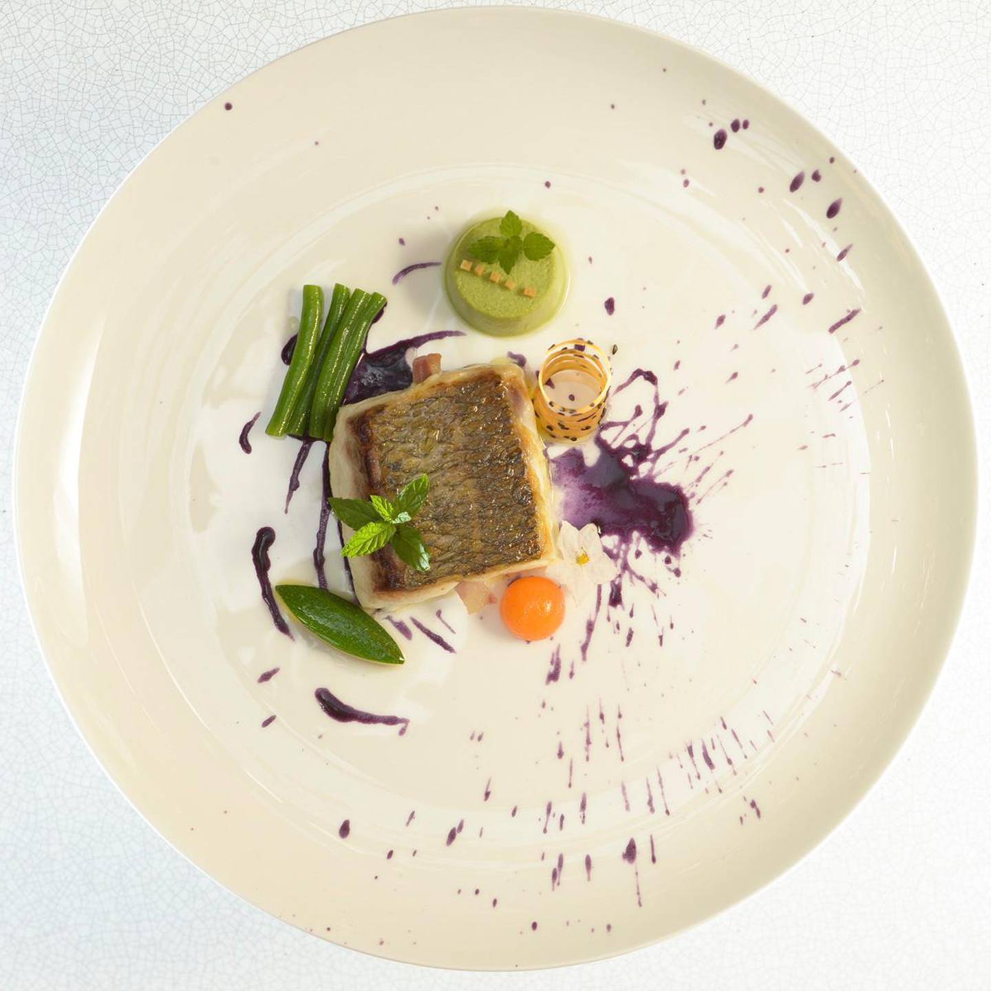 A handout photo of baked sea bass with light potato cream and white Alba truffle by Italian chef Antonio Mellino which will be offered at Amici (Photo by Sandro Michahelles)
 *** Local Caption ***  al21no-f1-amici.jpg