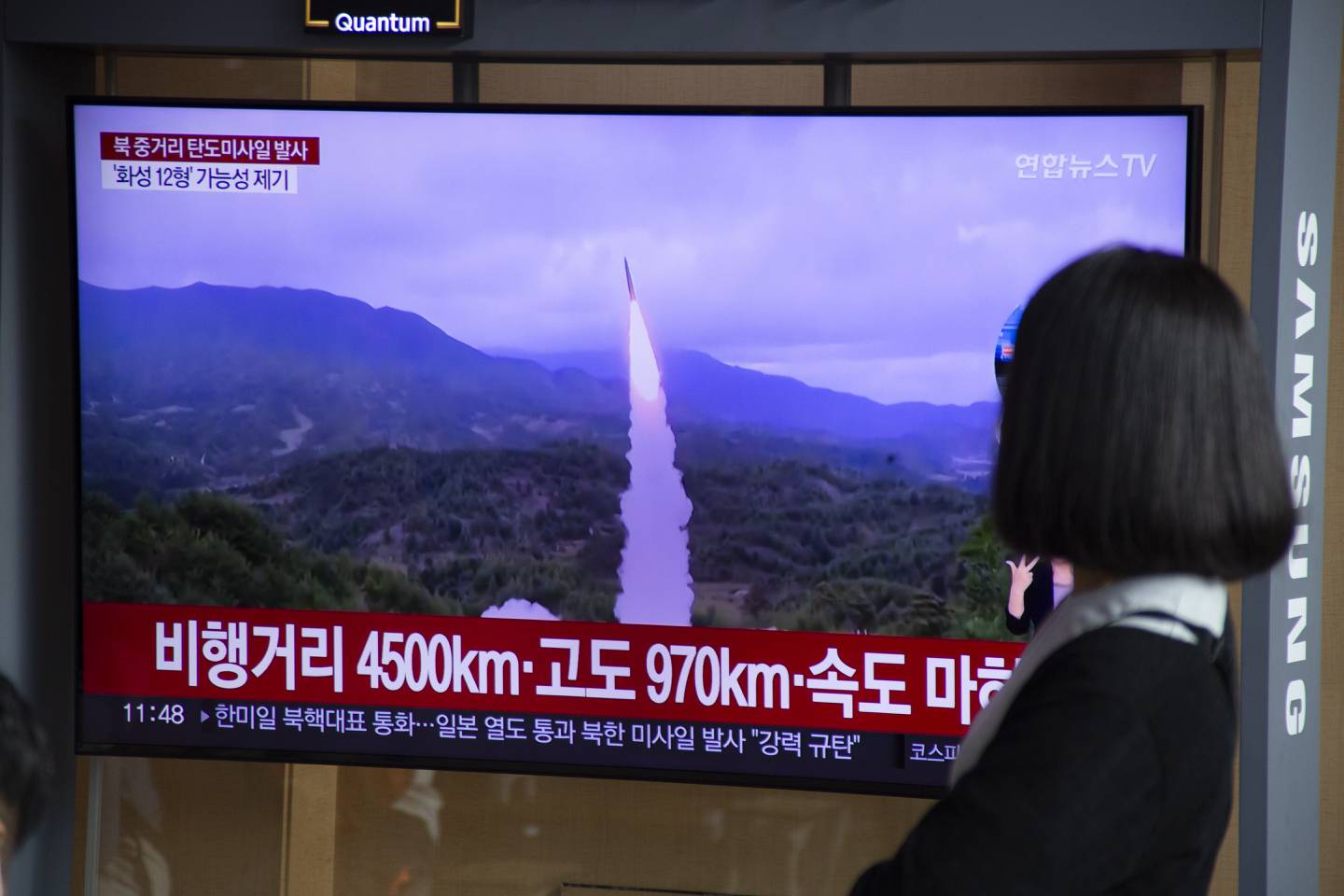 A woman watches the news at a station in Seoul, South Korea, on Tuesday after North Korea launched a ballistic missile over Japan into the Pacific Ocean. EPA