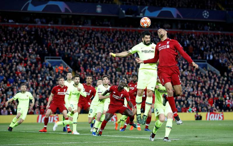 Liverpool's Fabinho fights Barcelona's Luis Suarez for possession. Reuters