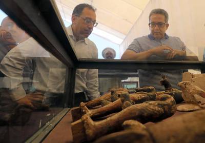 Egyptian Prime Minister Mostafa Madbouly and Minister of Antiquities Khaled El-Anany inspecting newly discovered artifacts on display outside 'Shedsu Djehuty' tomb in Luxor, Egypt. Reuters