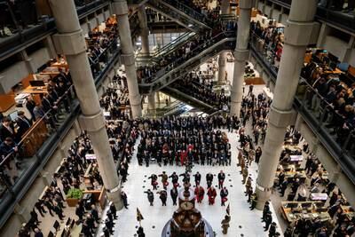 City workers attend a Remembrance Day ceremony at Lloyd's of London. PA
