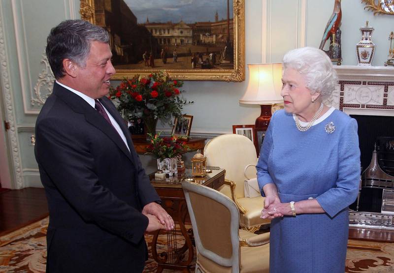 Queen Elizabeth II with Jordan's King Abdullah II at Buckingham Palace in London on November 15, 2011.  AP