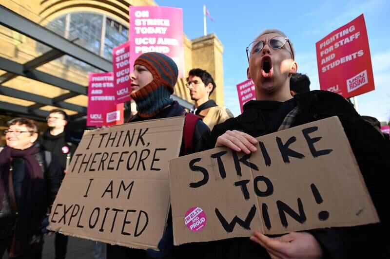 Employees demonstrate during a rally held by University and College Union members, in central London. EPA