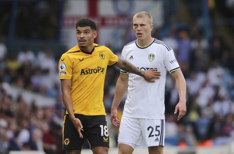 Leeds United's Rasmus Kristensen, right, sporting an injured eye socket, stands next to Wolverhampton Wanderers' Morgan Gibbs-Whit. AP