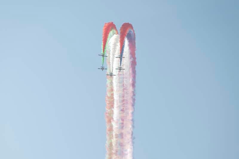 Aircraft perform manoeuvres at the airshow. 
