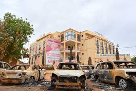 Burnt cars outside the headquarters of the ousted president's Nigerien Party for Democracy and Socialism in Niamey. AFP