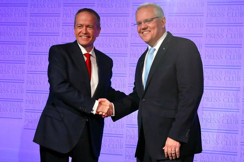 Australia's Labor leader Bill Shorten and Liberal leader and prime minister, Scott Morrison, shake hands at the start of "The Leaders' Debate" at the National Press Club of Australia in Canberra . AFP