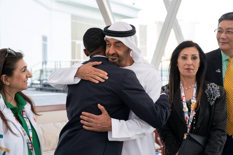 ABU DHABI, UNITED ARAB EMIRATES - March 18, 2019: HH Sheikh Mohamed bin Zayed Al Nahyan, Crown Prince of Abu Dhabi and Deputy Supreme Commander of the UAE Armed Forces (3rd R) hugs a member of the Special Olympics Higher Committee, during a Sea Palace barza. 

( Ryan Carter / Ministry of Presidential Affairs )?
---