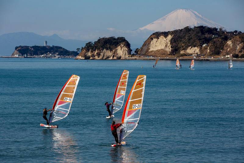 Windsurfers sail in Sagami Bay, where sailing events for postponed Tokyo 2020 Olympics will be held, in Kamakura, west of Tokyo. AP Photo