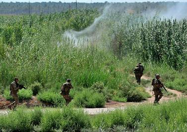 Iraqi forces during a search operation in Taramiyah, 50 kilometres north of Baghdad, April 30, 2020. AP