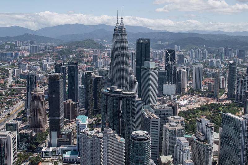 This general view shows the Kuala Lumpur city skyline as seen from the Kuala Lumpur Tower on February 24, 2020. - Malaysian politics was in turmoil on February 24 after leader-in-waiting Anwar Ibrahim denounced a "betrayal" by coalition partners he said were trying to bring down the government, two years after it stormed to victory. (Photo by Mohd RASFAN / AFP)