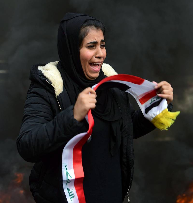 A female protester weeps as she take part in a mourning procession for the victims of protests at the Al Tahrir square in central Baghdad.  EPA