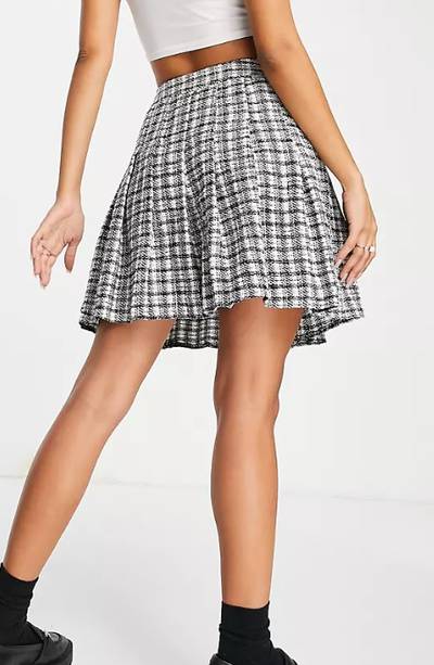 New Look's black and white chequered mini tennis skirt is purely for serving up style off the court. Dh77.04, www.asos.com. Photo: New Look