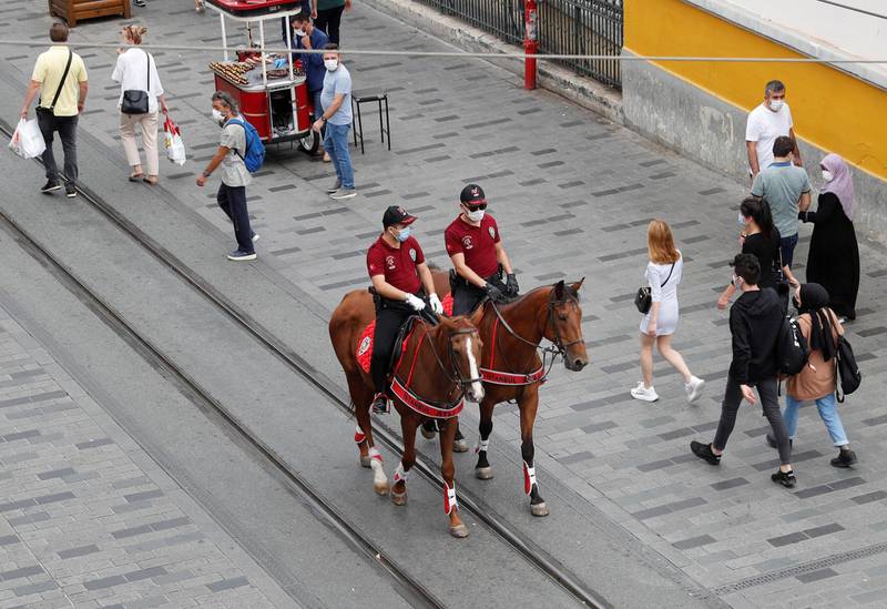 Members of Istanbul Police Department Mounted Unit patrol against people not wearing protective face masks at the main shopping and pedestrian street of Istiklal as the spread of the coronavirus disease (COVID-19) continues, in Istanbul, Turkey. REUTERS
