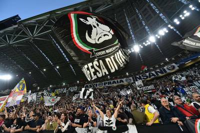 Juventus fans cheer before the match. Giuseppe Cacace / AFP