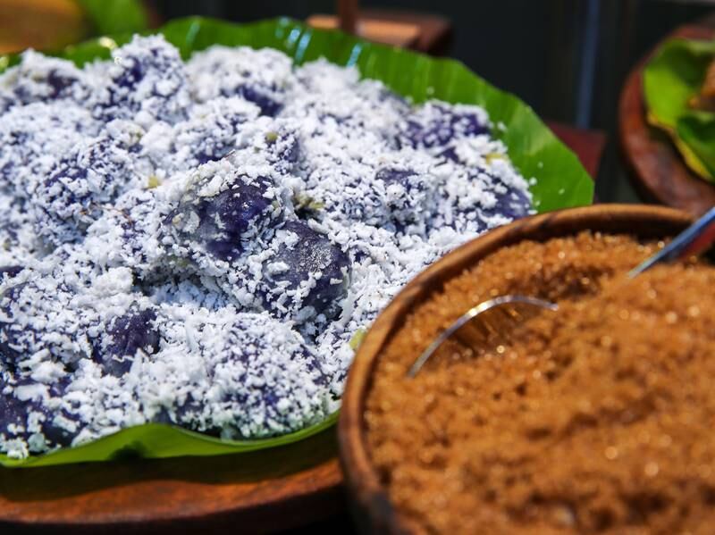 The puto bumbong balls at Hot Palayok are made from rice flour with purple yam steamed in bamboo tubes. It's topped with fresh coconut and a pinch of brown sugar.